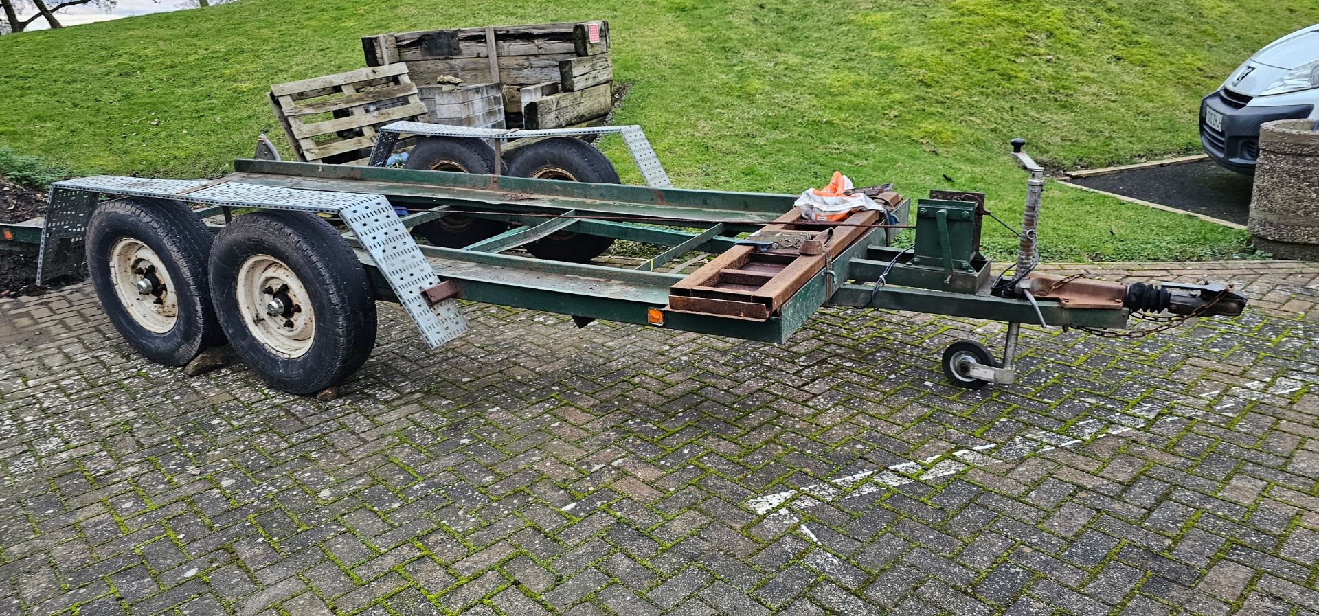 A heavy duty twin axle car trailer with ramps and winch, Knott Avonride 1800 kgs axles with the