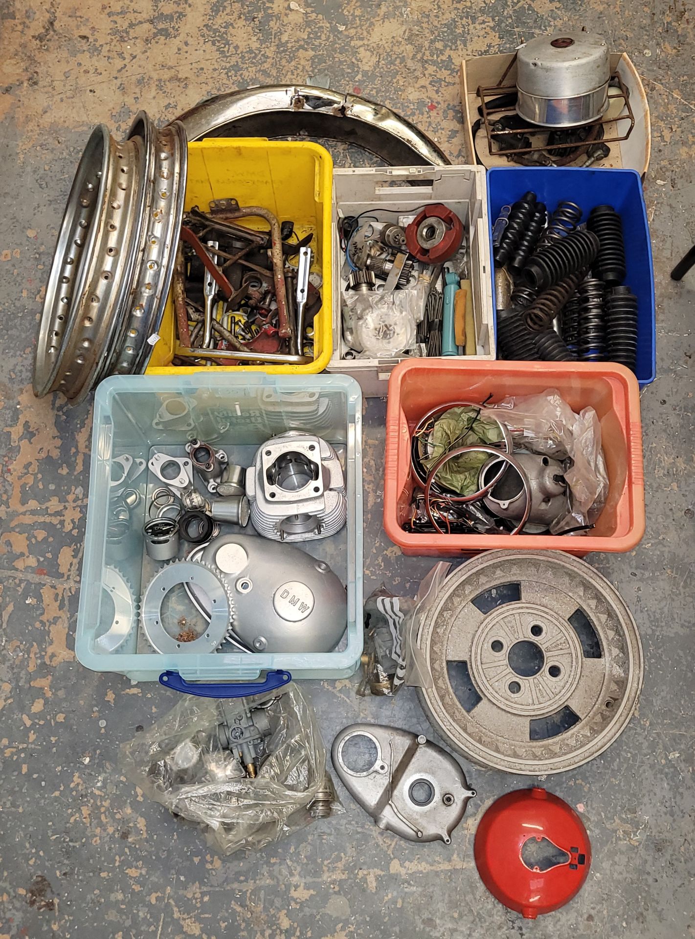 A collection of mainly DMW spares, including side panels and carb parts