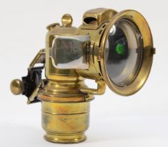 A rare Lucas Garda carbide brass car lamp with side rear red lens