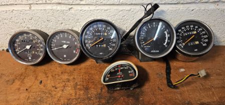 A pair of Suzuki 110MPH clocks, a pair of 140MPH clocks and two others