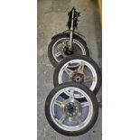 A Honda Superdream front wheel and forks, and a pair of Honda front and rear wheels