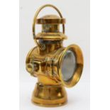 A brass era Duco by Brown brothers oil fired side lamp, 29cm.