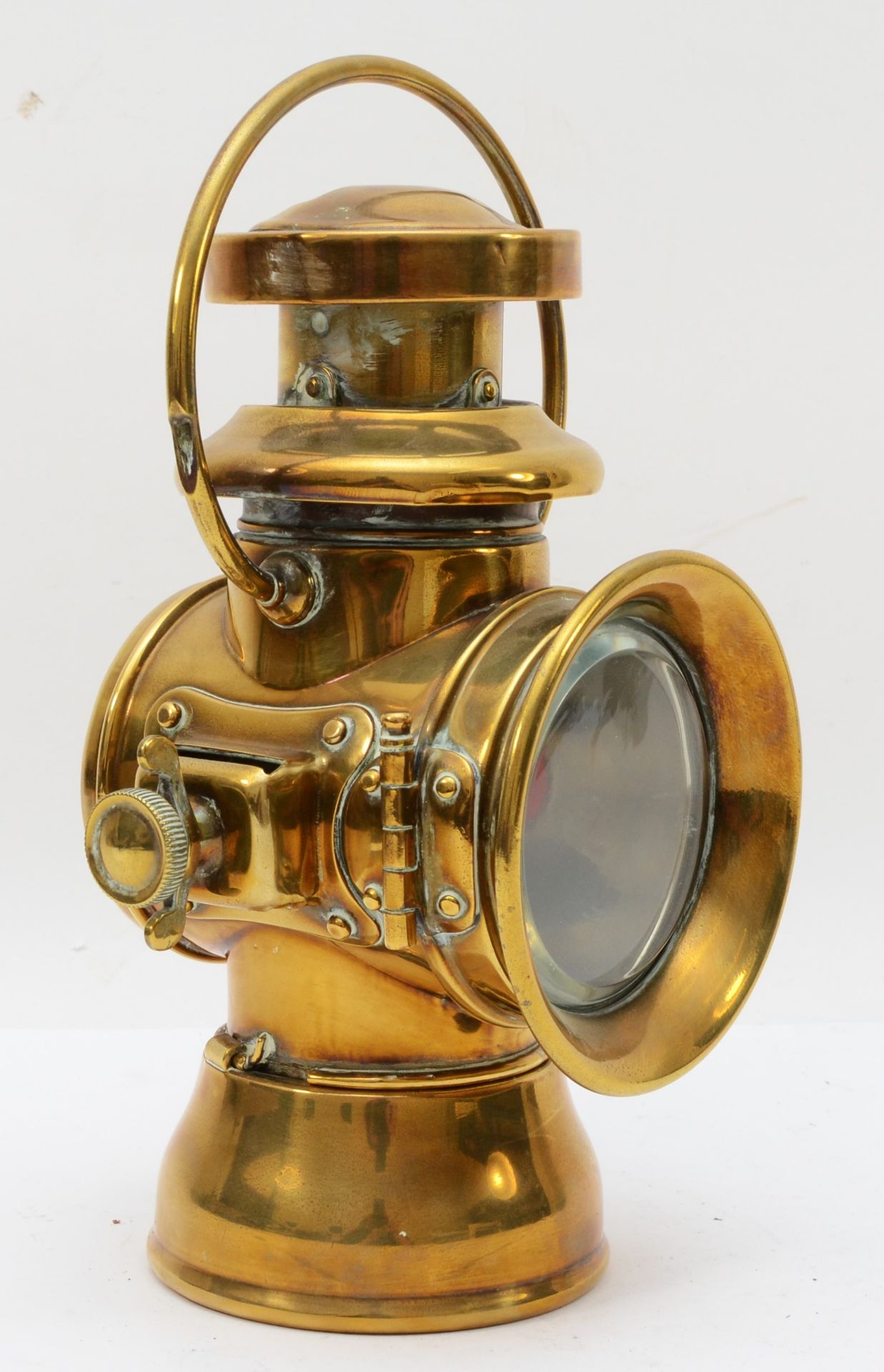 A brass era Duco by Brown brothers oil fired side lamp, 29cm.
