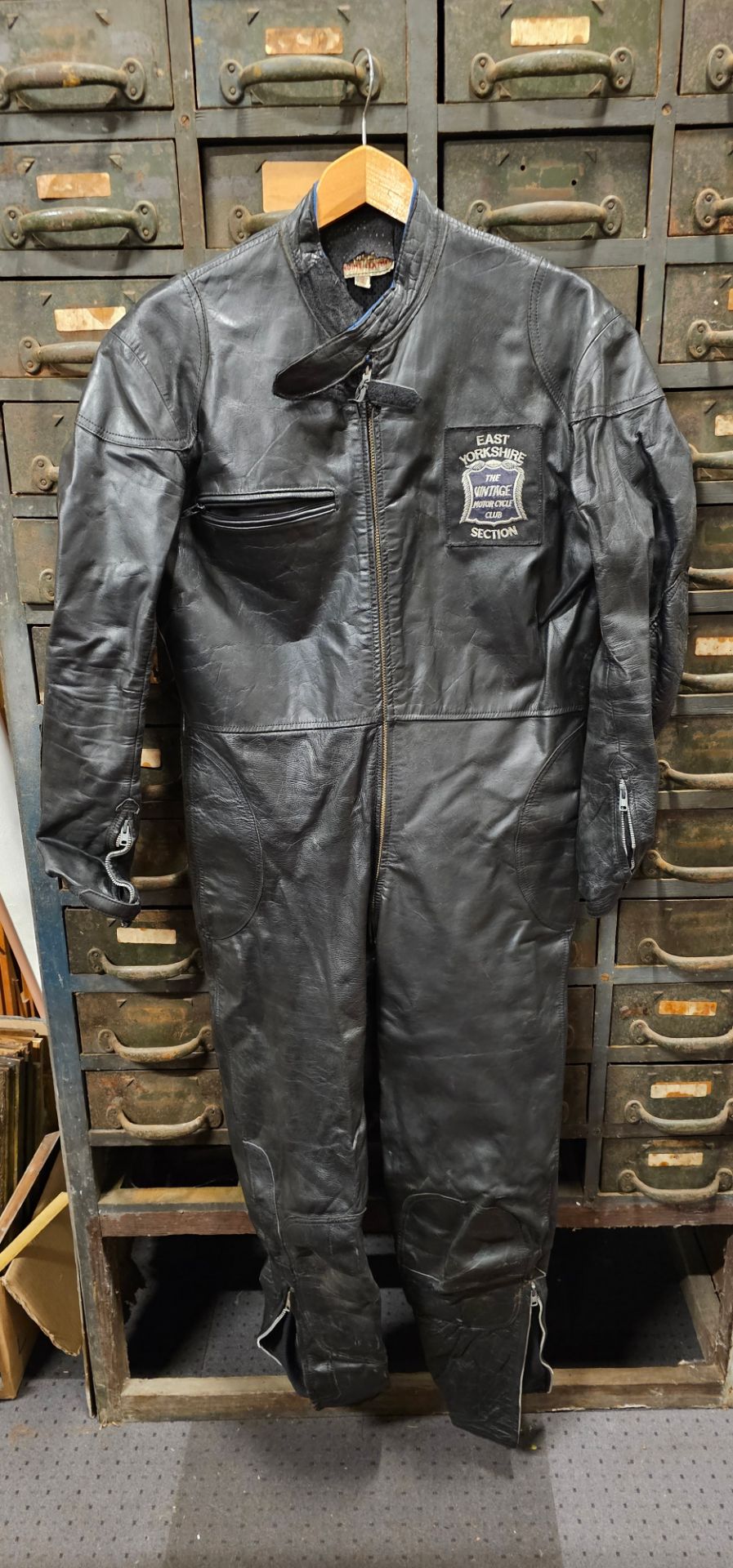 A Lewis Leathers one piece leather suit, size 42, recent lining, with original ticket and cloth