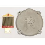 A gold plated and enamel RREC grill badge and an alloy RR cover plate, part no G50143 (2)