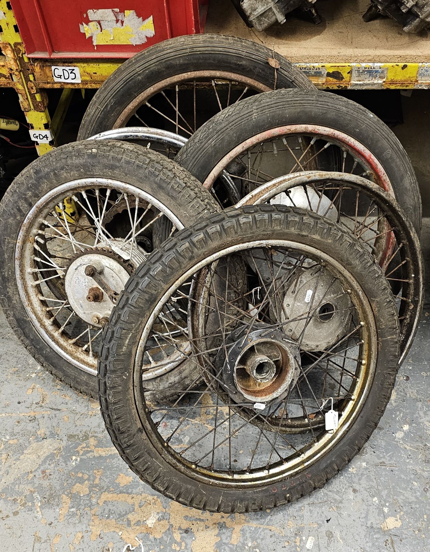 A Triumph Tiger Cub front wheel and 5 other Triumph wheels