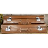 A two piece tan leather trunk set, 82 x 58 x 15cm and 82 x 48 x 15cm (2)