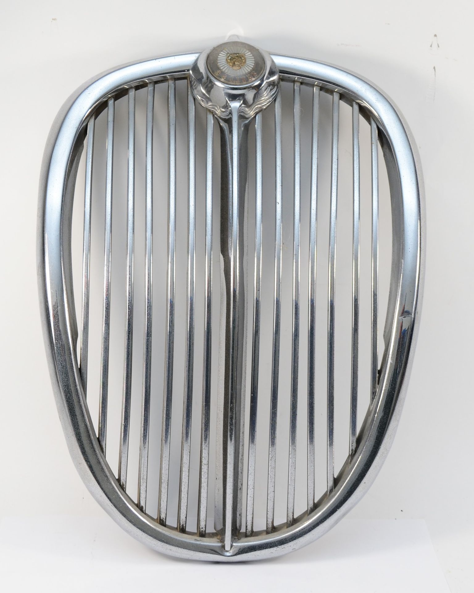 A Jaguar MkII chrome grill with 3.8lt badge