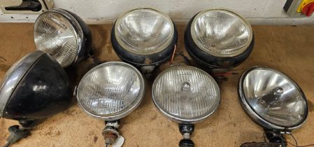 A pair of Cibie Super Oscar spot lamps, a pair of Lucas 700 headlamps and three other lamps