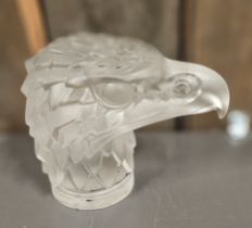 A Lalique style eagles head moulded glass car mascot, impressed Made in Czechoslovakia, 12cm