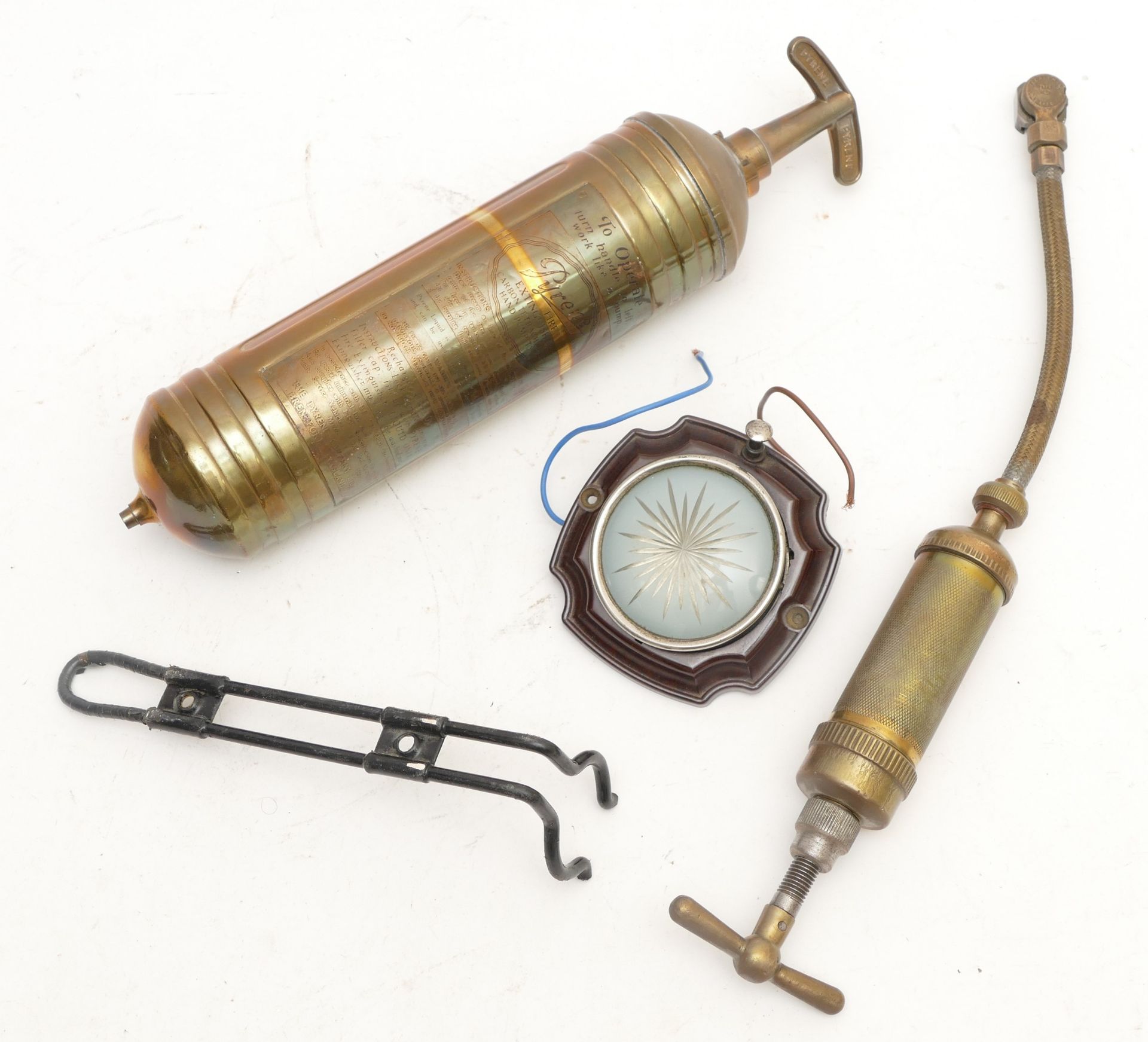 A Pyrene brass fire extinguisher with mounting bracket, a Tecalemit Type 41 grease pump and a