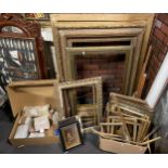 A large collection of gilt picture frames of various sizes, together with sealed packaged beeswax