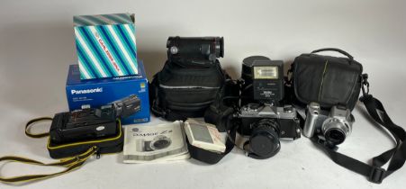 A collection of digital cameras and lenses, to include a Konica Minolta Dimage Z2, a Fujica St605, a