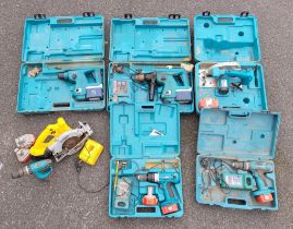Cased Makita power tools to include two BHR200 drills, a 5621 RD 165mm circular saw, a 8390D and