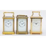 Churchill; a contemporary brass cased carriage clock, the white dial with black Roman numerals and