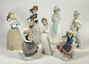 Nao; four 20th century painted porcelain figures of various girls together with three Lladro