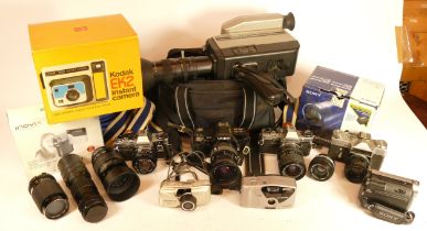 A collection of cameras and lenses, to include a Minolta AF7000, Olympus OM10, Zenit's No.