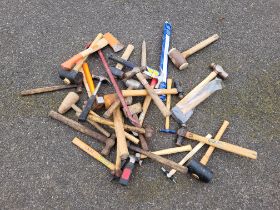 A group of various hammers, mallets and axes.