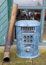 A Victorian style blue painted cast iron fire/heater with brass chimney, 65cm high.