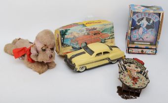 A 20th century Japanese musical clockwork poodle, together with a boxed Minister Delux car, a