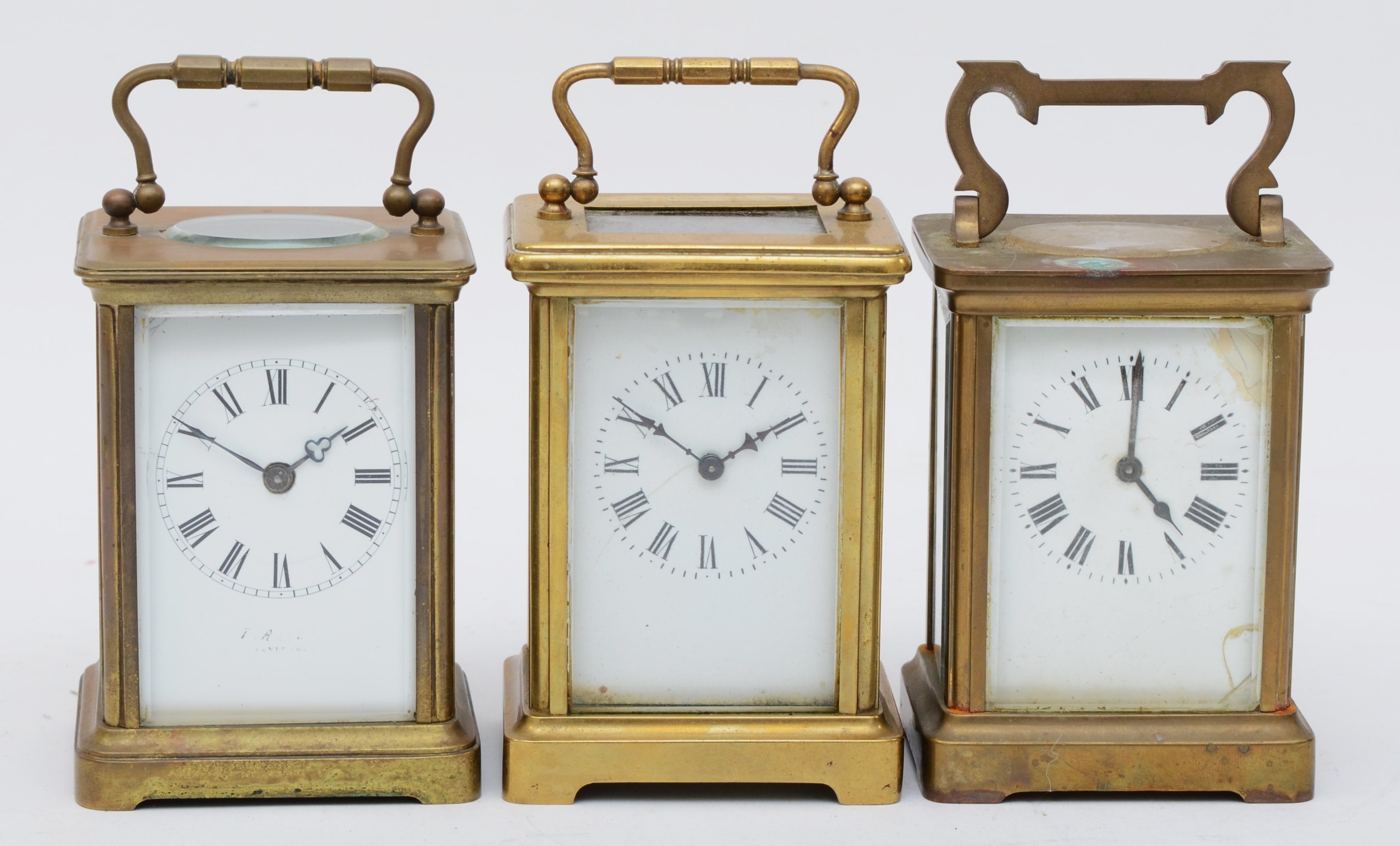 Three 20th century brass cased carriage clocks, each with white dials and black Roman numeral and