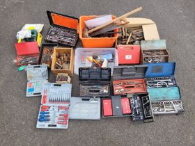 A shelf of used tools to include a cased Phil Merco socket and attachment set, with other cased