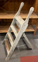 A set of painted pine four tread step ladders