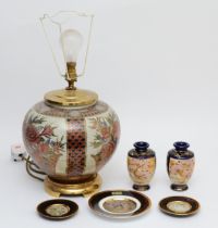 A pair of early 20th century Japanese Satsuma pottery vases, decorated with panels of samurai and