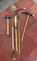 A group of vintage hand tools to include a C.T Skelton & Co peat spade, a grub axe, and scythe.