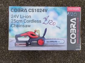 A Cobra CS1024V cordless 25cm chainsaw, unused in box.