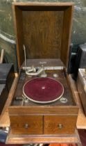 An early 20th century oak cased wind up gramophone by Maxitone.