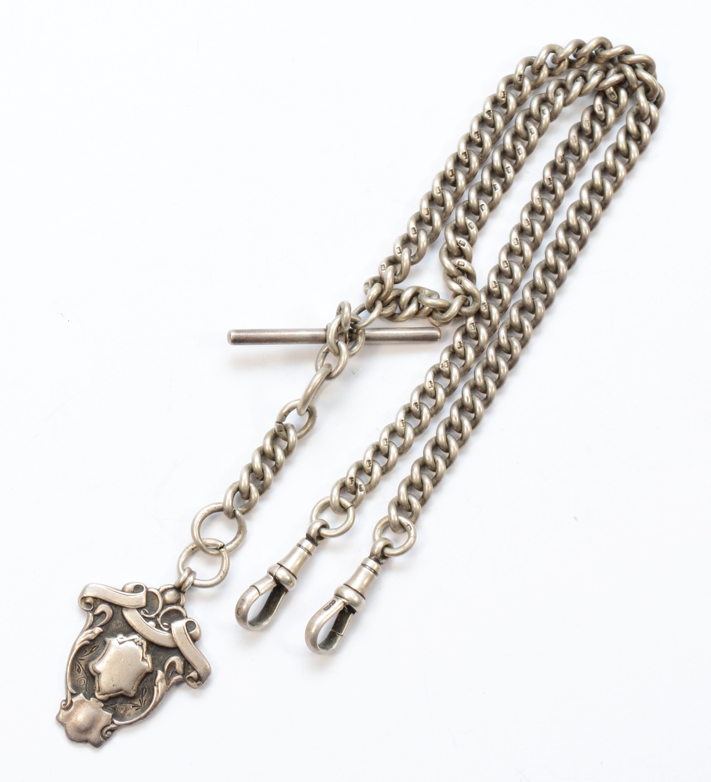 A George V silver curb link t-bar pocket watch chain, by Herbert Bushell, Birmingham 1916, with a