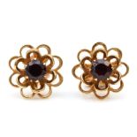 A pair of 9ct gold garnet floral stud earrings, 11mm, 1.5gm.