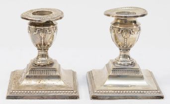 A pair of Edward VII silver squat urn candle sticks, by Fordham & Faulkner, Sheffield 1907, 8.5cm,