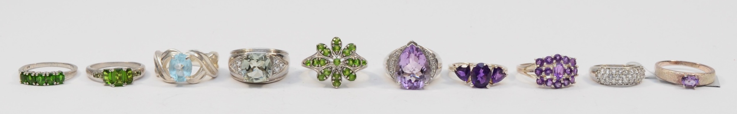 Ten silver gem set rings to include a single stone amethyst cocktail dress ring, N, 45gm.