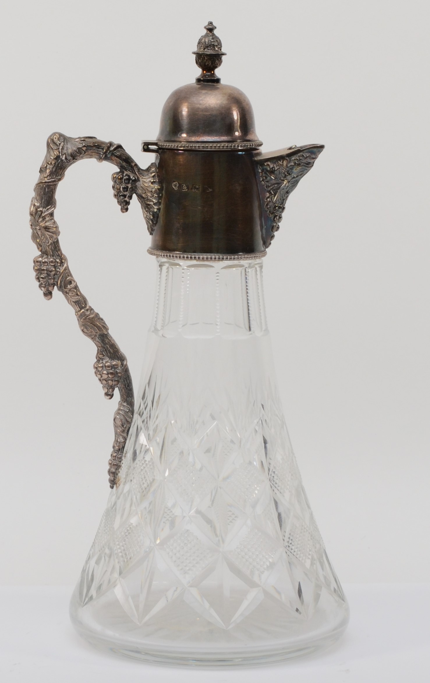 A cut glass and silver mounted claret jug, by Warwickshire Reproduction Silver, Birmingham 1972, the