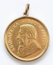 A 1982 1/2 gold Krugerrand, in a gold mount, 18.3gm.