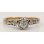 An 18ct gold and platinum set single stone brilliant cut diamond ring, estimated weight .25, K, 2.