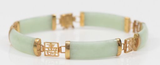 A 9ct gold jadeite paneled bracelet, 19.5cm, 10.9gm.