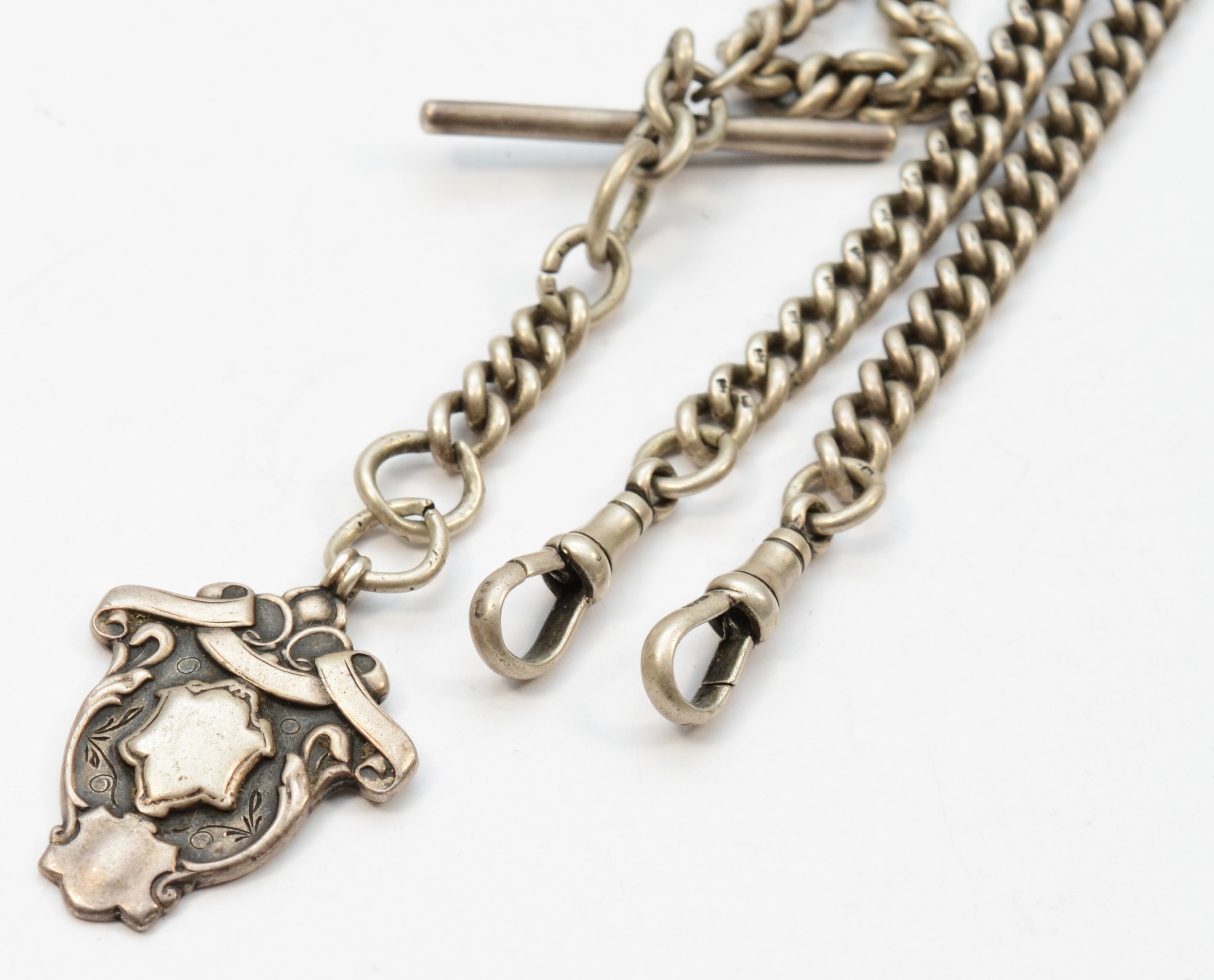 A George V silver curb link t-bar pocket watch chain, by Herbert Bushell, Birmingham 1916, with a - Image 2 of 2