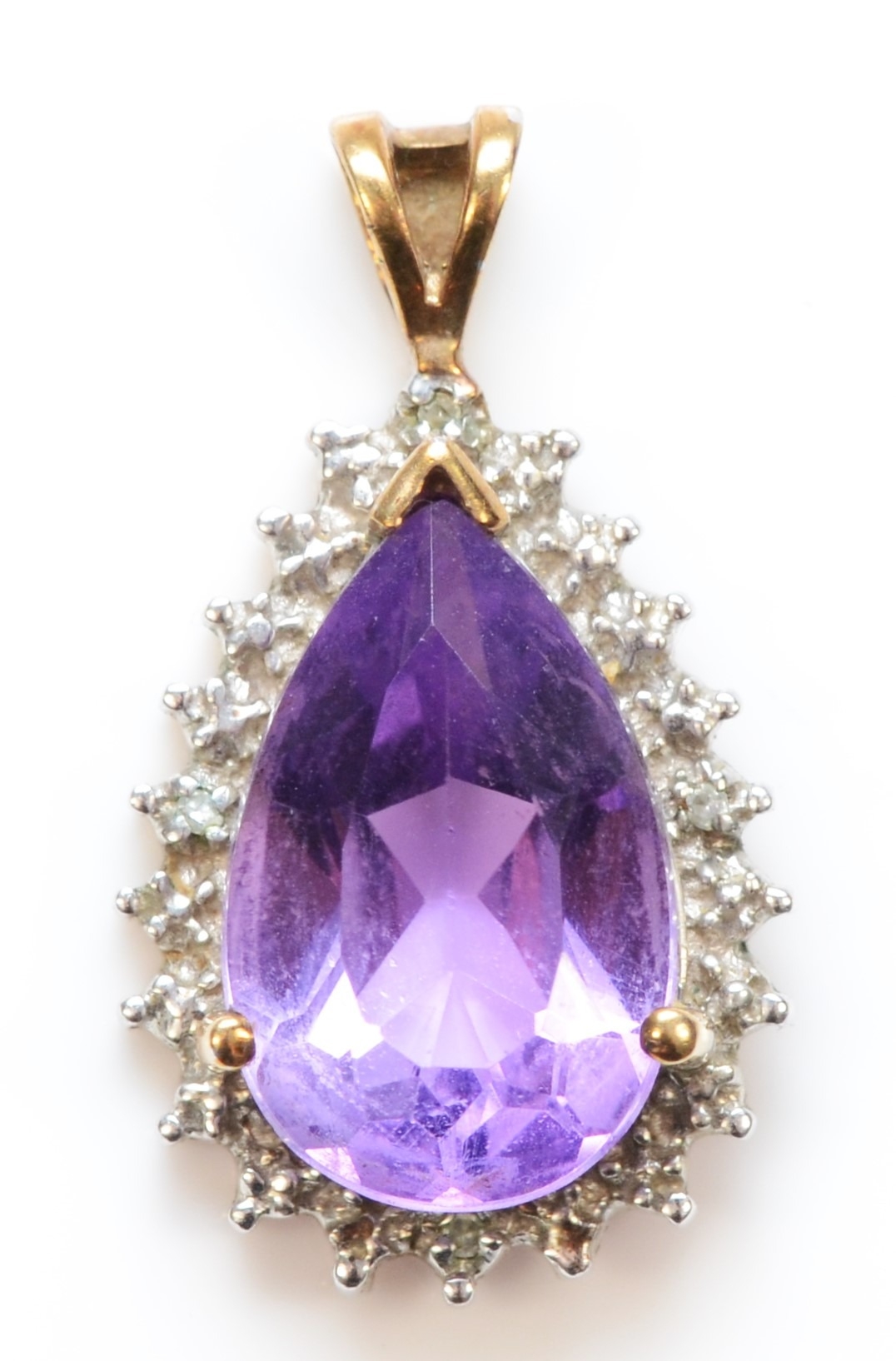 A 9ct gold amethyst and illusion set diamond pendent, 23 x 13mm, 2.5gm.
