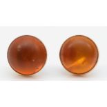 A pair of gold Baltic amber stud earrings, 9mm, 1.1gm, lacking backs.