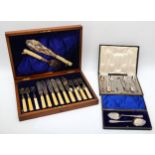 A cased set of electroplated silver fish flatware, together with a cased set of sliver plated