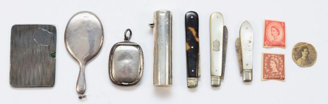 A group of silver items to include a George V silver and green paste stone sliding stamp case, by