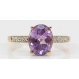 A 9ct gold amethyst and eight cut diamond dress ring, P, 2gm.