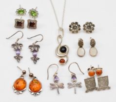 Nine pairs of silver earrings to include a pair of Baltic amber drop earrings, 27mm, together with a