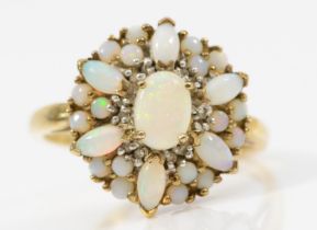 A 9ct gold opal floral cluster ring, flashes of red and green, T, 3.7gm.