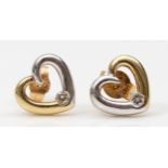 A pair of 9ct gold two tone heart shaped stud earrings, with brilliant cut diamonds, 8mm, 1.3gm.