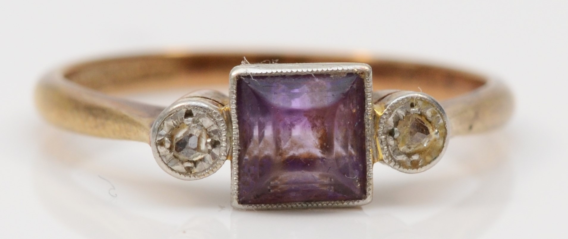 A gold and platinum set amethyst and mine cut diamond dress ring, Q, 2.4gm.