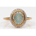 A 9ct gold aquamarine and diamond cluster ring, with baguette and brilliant cut diamonds, T, 3gm.